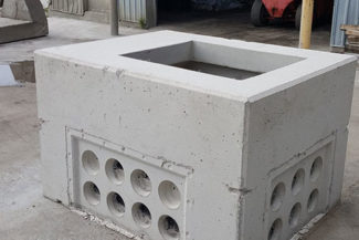 precast concrete hydro vault in front of garage
