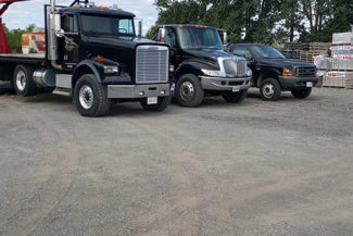 trucks lined up in yard