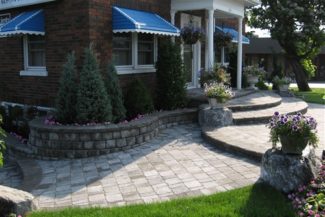 interlocking stone patio and steps in front of house