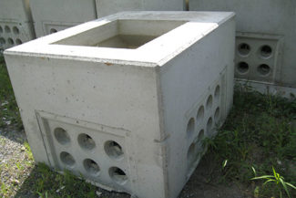 stacked concrete hydro vaults in yard