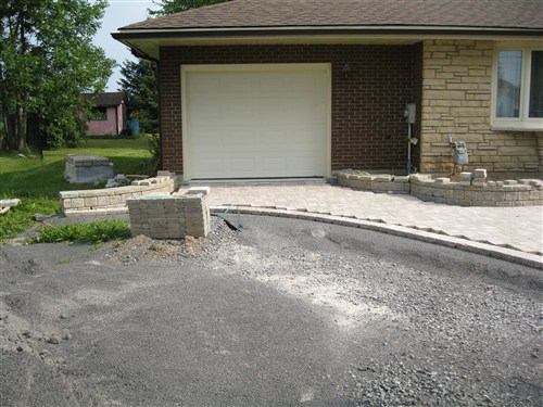 interlocking stonework project in front of house